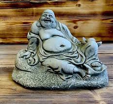 stone garden laughing buddha laying
