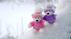 teddy bear couple on snowy ground