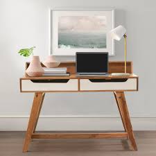This desk comes with two cubbies on its underside for easy storage, keeping working materials out of the way until needed. Solid Wood Scandinavian Splayed Desks For Small Spaces With Storage