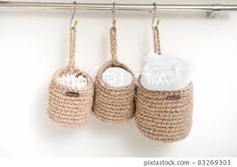 Three Wicker Mini Baskets Hanging On A