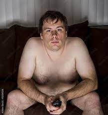 Obese naked man watching TV Stock Photo | Adobe Stock