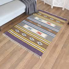 handloomed purple wool area rug with