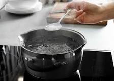 What helps water boil faster?