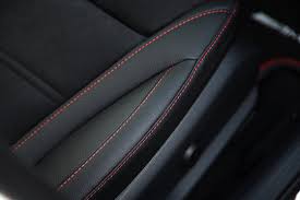 Red Stitching On Black Leather Car Seat
