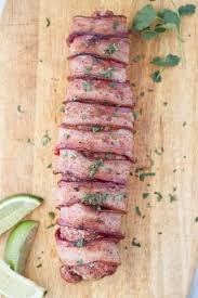 Learn how to prepare, stuff, wrap and bake pork tenderloin in bacon. Traeger Bacon Wrapped Pork Tenderloin A License To Grill