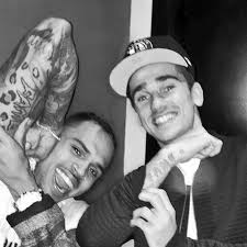 Across the knuckles of griezmann's right hand there exists words which read as hope. Antoine Griezmann Hangs Out With Chris Brown Into The Calderon