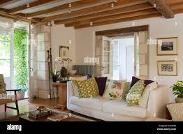 living room with wooden ceiling beams