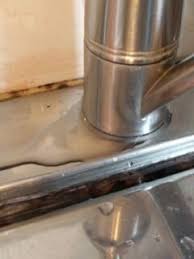 how to seal kitchen faucet base in