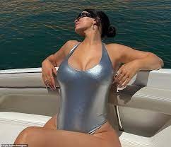 Kylie Jenner in a plunging silver swimsuit while 'on a lake' | Daily Mail  Online