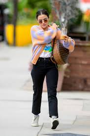 lucy hale wears a colorful cardigan as