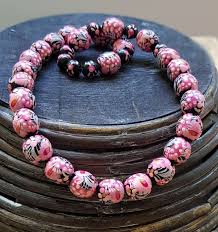 beaded necklace pink and black wooden