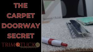 a doorway trim tuck carpets