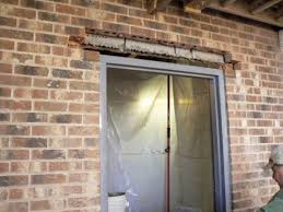 a steel door in a brick foundation