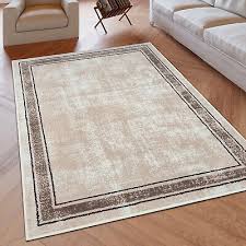 large cream rug brown border pattern