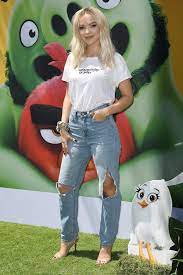 Dove Cameron attends the premiere of ' The Angry Birds Movie 2' at the  Regency Theater in