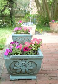 A Beautiful Summer Garden And Painted Pots