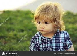 cute baby boy outdoor stock photo by