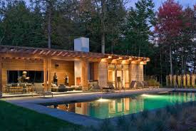 rustic pool house includes fireplace