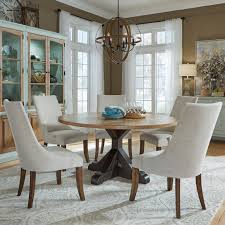 A tasteful dining set of natural finished wood. Pulaski Furniture The Art Of Dining 6 Piece Round Table And Upholstered Chair Set Upper Room Home Furnishings Dining 5 Piece Sets