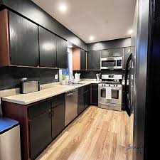 wood and black kitchen cabinets