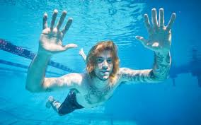 The baby featured in nirvana's iconic nevermind album cover, spencer elden, is now accusing the band of sexual exploitation in a $150k lawsuit. Want To Feel Old Here S What The Baby From Nirvana S Nevermind Looks Like Today
