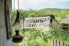 Old And Dusty Oil Lamp Hanging In A