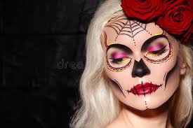 This quick history lesson will help you understand how this festive holiday began. Beautiful Halloween Make Up Style Blond Model Wear Sugar Skull Makeup With Red Roses Santa Muerte Concept Stock Photo Image Of Demon Folklore 161670650