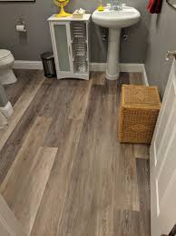 warm bathroom flooring featuring modern