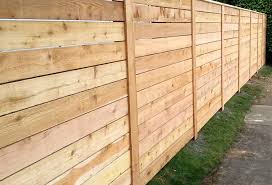 Wood fences don't always have to enclose something. Horizontal Wood Fences A Better Fence Company Horizontal Fences