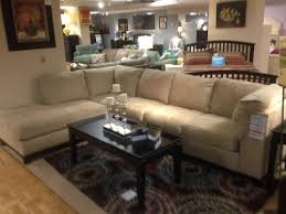 khaki colored couch and my area rug