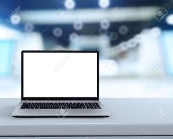 Laptop With Blank Screen On White Desk With Blurred Background As Concept  Stock Photo, Picture And Royalty Free Image. Image 38966459.