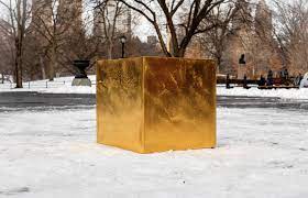 a mive gold cube has been placed in