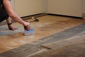 install wood flooring over tiled floors