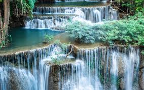 lovely cascading waterfall with green