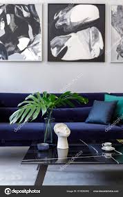 blue velvet sofa mock paintings