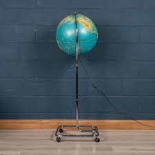 illuminating globe on a chrome stand