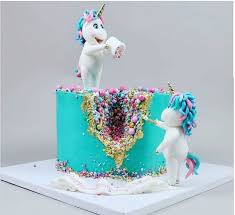 An easy funfetti unicorn cake recipe adorned in pastel buttercream and topped with a golden horn will bring magic to any occasion! Unicorn Themed Birthday Cake