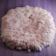 a round rug with a fluffy white fur on