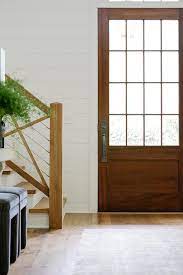 cherry stained wood front door with