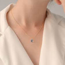 blue topaz necklace light