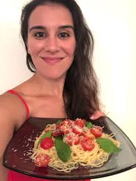 In a large bowl, stir together the cherry tomatoes, 1/2 cup olive oil, garlic, basil, red pepper flake, 1 teaspoon of salt, and pepper. Ina Garten S Summer Pasta Dish With Tomatoes Is Easy To Make