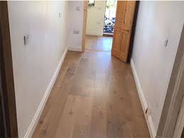 installing wood flooring in a hallway