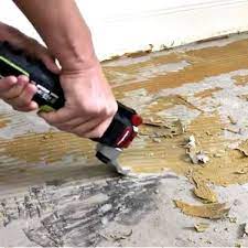 remove adhesive from concrete floors