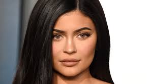 kylie jenner debuts neon yellow winged