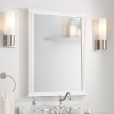 A bathroom vanity mirror is usually placed above the bathroom sink and are particularly used for applying makeup, checking one's appearance, fixing one's hair, or basically anything that helps you to look presentable. Livia Vanity Mirror White Bathroom Mirrors Bath Accents