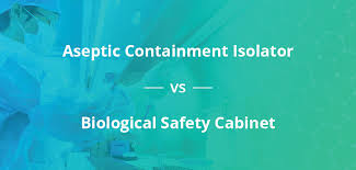 aseptic containment isolator vs