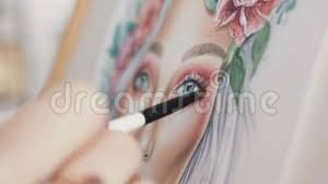 Make Up Artist Comes Up With Makeup Using A Face Chart The Artist Makeup Paints Face Woman On Paper And Smears A Small