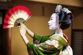 a woman in geisha costume stock photo