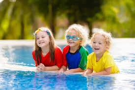 Kids in swimming pool. Children swim. Family fun. Stock Photo by  ©FamVeldman 248163108