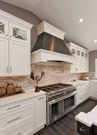 Price and stock could change after publish date, and we may make money from these links. White Kitchen Cabinets For Your Cozy Kitchen White Kitchen Cabinets With Marble Subway Tile And Ove Kitchen Design Kitchen Cabinets Decor White Kitchen Design